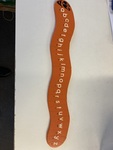 1123: Orange wooden alphabet caterpillar puzzle 