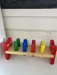 Smash peg board with hammer