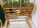 Wooden dolls cot