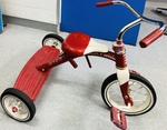 Big fast red tricycle