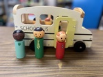 Wooden school bus with people 