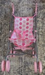 Pink spotty dolls pram
