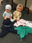 Twin dolls with clothing