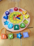 wooden clock with pieces