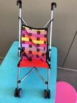 983: Red and check stroller