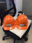 2 orange hard hats 