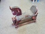 BROWN WOODEN ROCKING HORSE