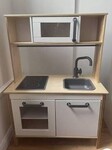 Wooden Kitchen with pots and food