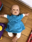 Baby doll in blue outfit