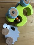 Two wooden baby push along hand toys