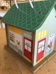 Wooden pet shop. Opens with handle 