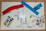 Box of dominoes with race track