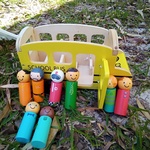 Wooden school bus with people