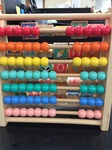 WOODEN ABACUS WITH COLOURED BEADS AND ALPHABET BLOCKS