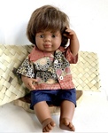 96: Aboriginal boy doll dressed in fire dreaming olive