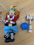 Wooden pull-string dancing clown