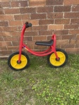 13: Red metal balance bike