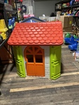 Cubby house red roof orange door