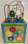 Wooden activity cube with bead frame