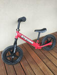 Strider red balance bike