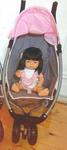 Baby Jogger pram and doll