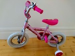 Pink bicycle with training wheels PC 