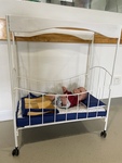 White cot with wheels