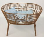 Rattan bassinet with bedding