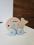 Wooden whale on wheels
