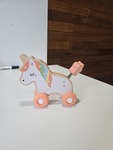 Wooden unicorn on wheels
