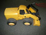 Little tikes sit on bulldozer