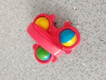 Red Rattle with Colourful Rolling Balls