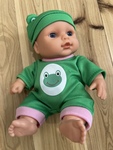Baby doll in frog costume