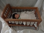 Baby in a cot