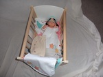 Cradle with sight impaired doll