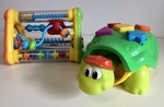 Shape press turtle and Playgro activity toy