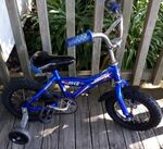 Blue bike with trainer wheels