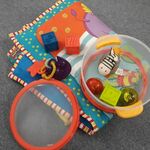 Playmat with a container of baby toys