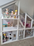 Wooden dolls house with furniture and dolls