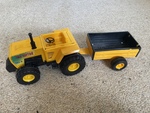 Yellow Tractor, Trailer and Cow