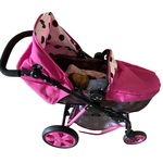 Pink pram with doll