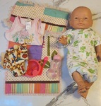 Baby doll with clothes and accessories 