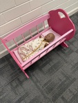 C61: Wooden crib and baby doll